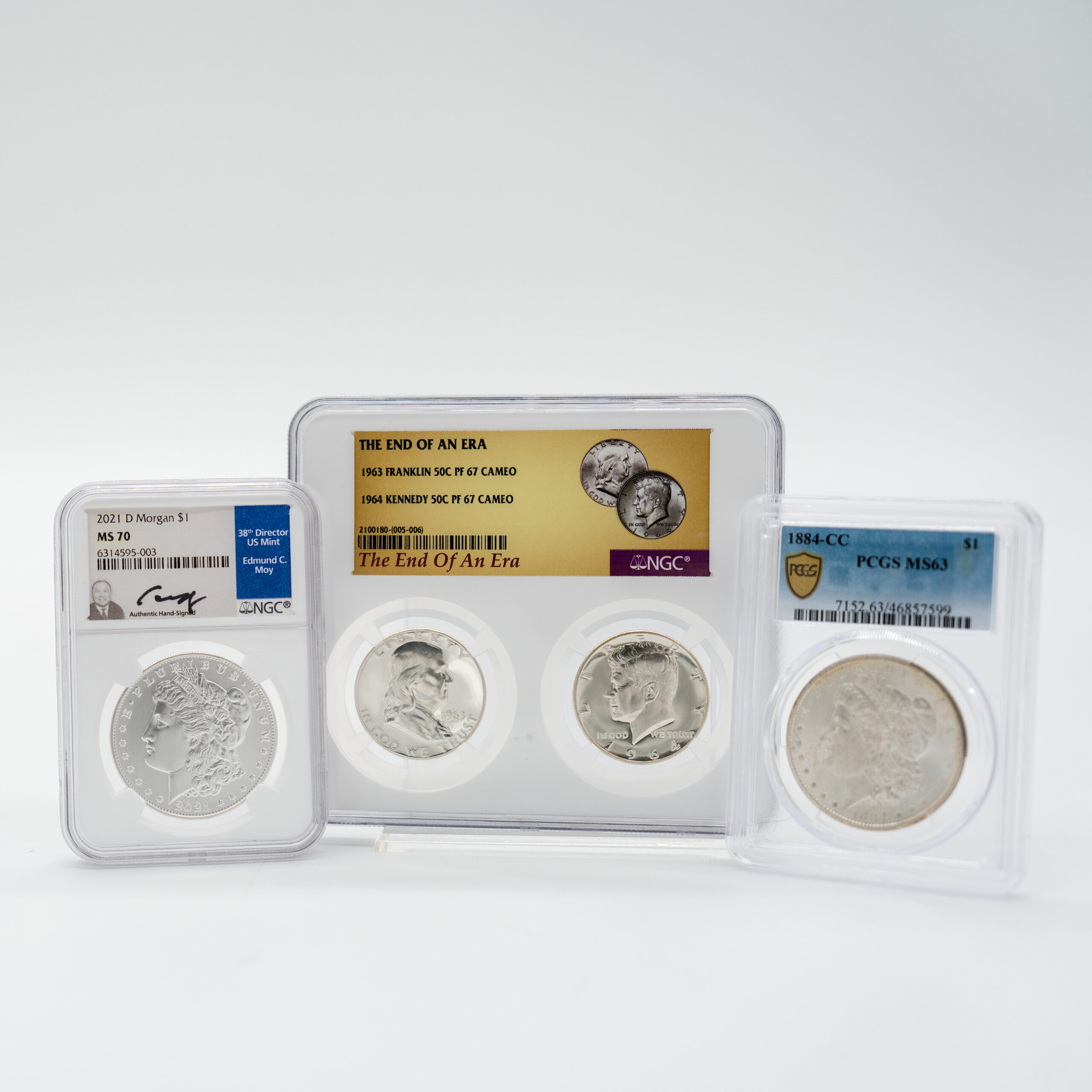 Clean studio product photography of collectible graded coins