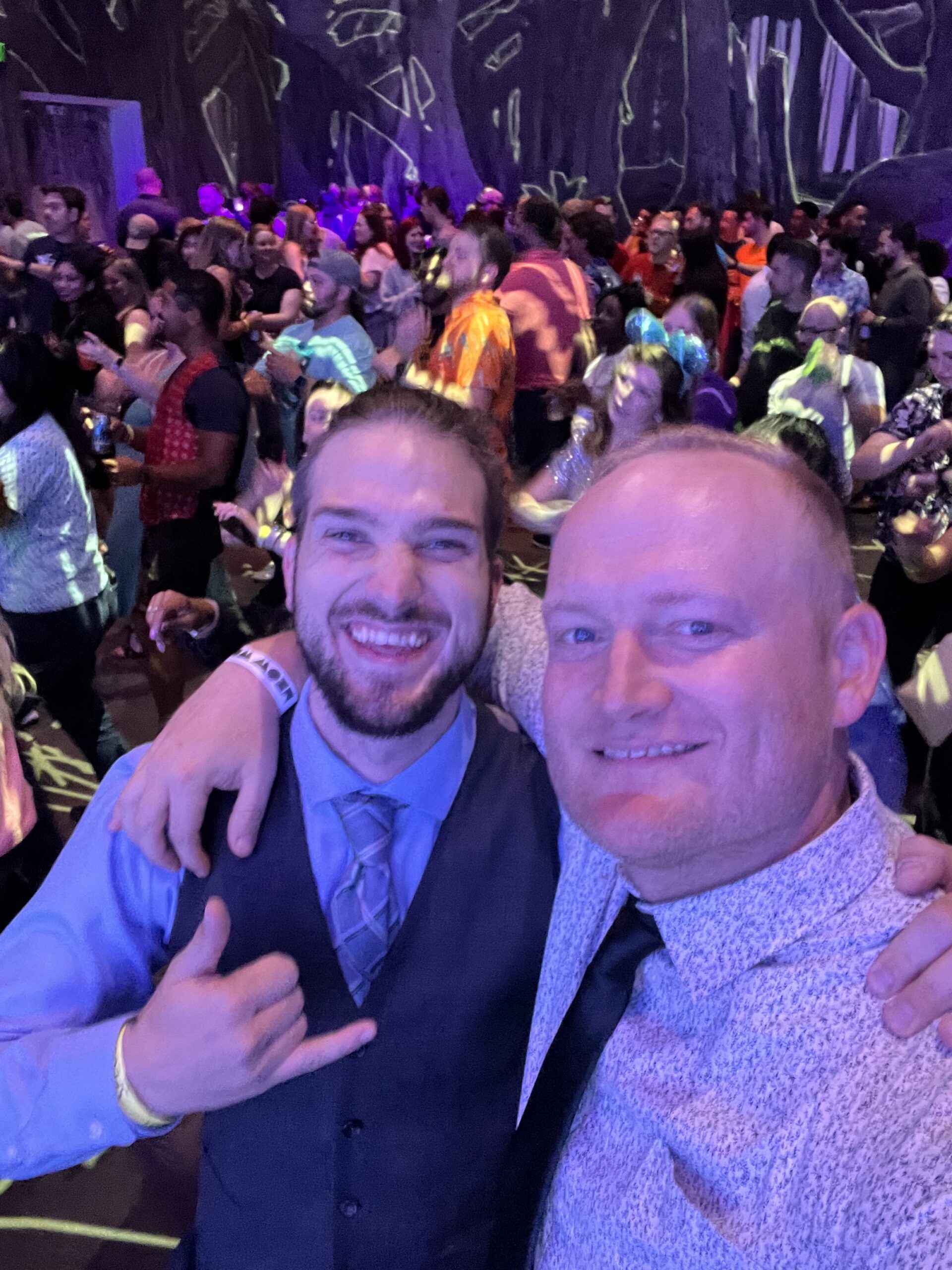 Devin and Jared sharing a candid moment during an evening celebration