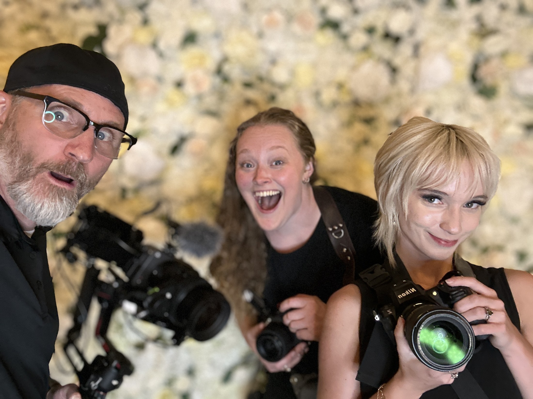 Emberlight Media photographers sharing a candid moment while working together