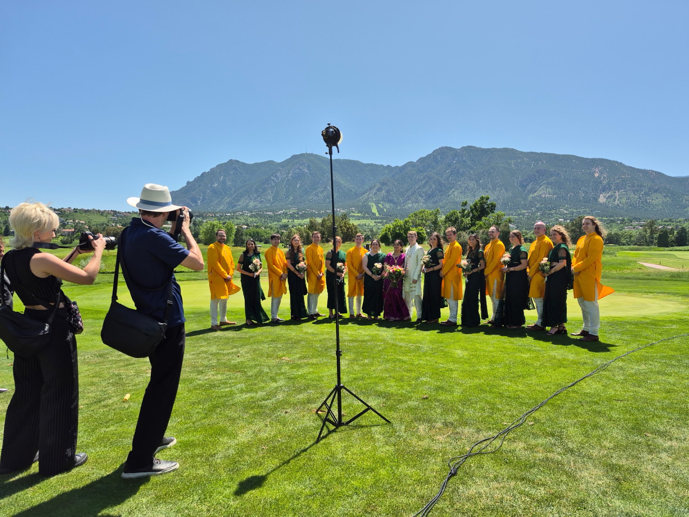 Two Emberlight Media photographers working together at a Colorado wedding